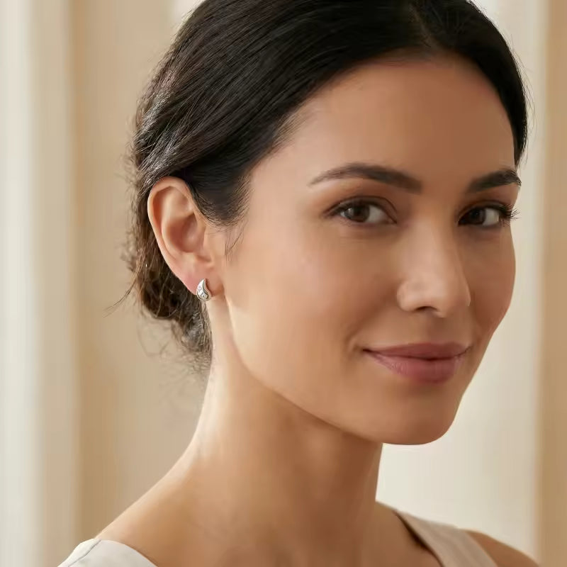 Elegant Silver Teardrop Stud Earrings with CZ Accents