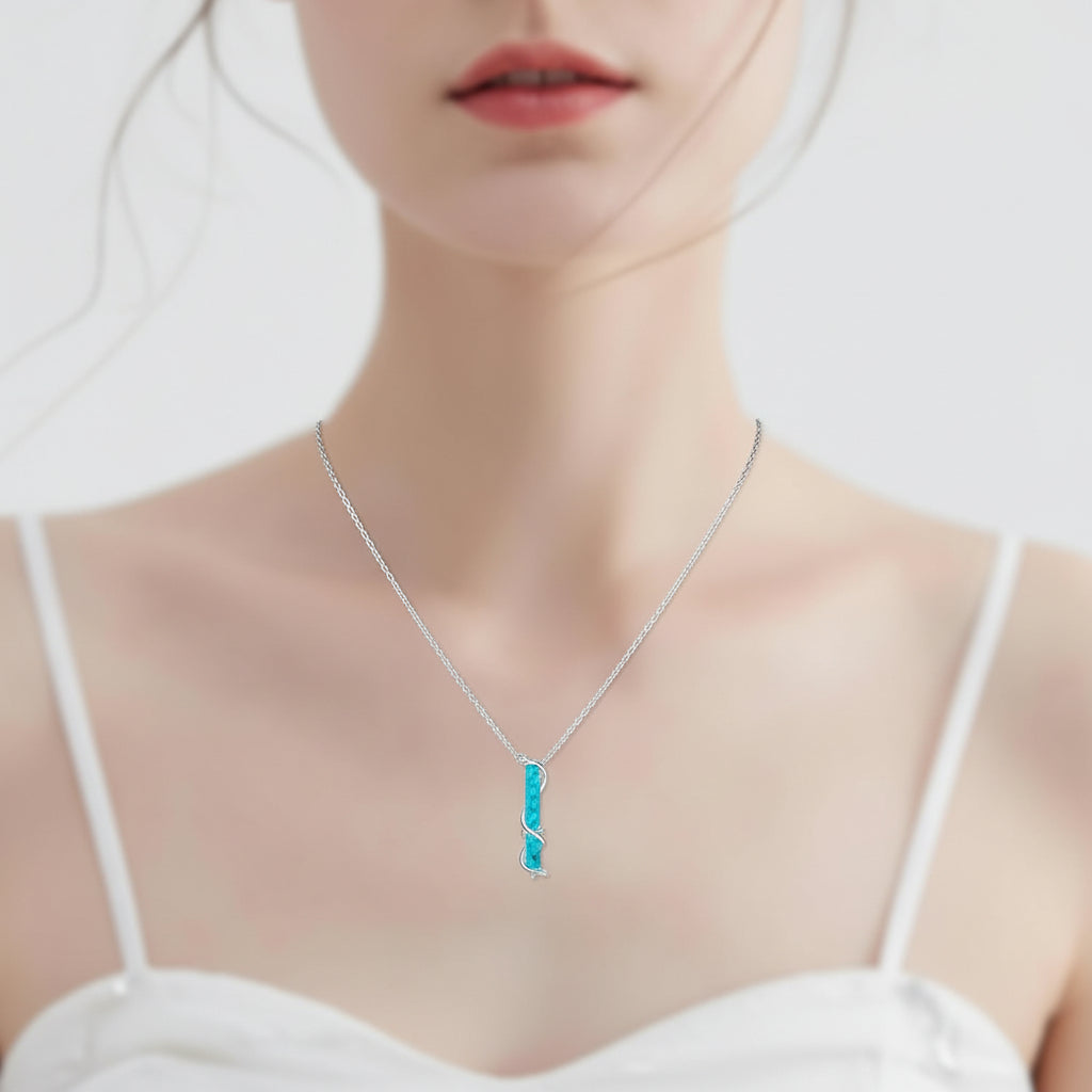 Turquoise Pendant With Vine Design