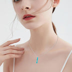 Turquoise Pendant With Vine Design