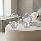 Elegant Gilded Huggie Hoop Earrings with Textured Sphere Charm
